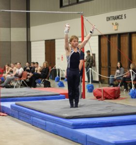 Davila sticks his high bar landing