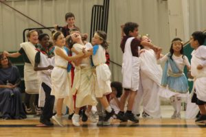 Students celebrate a win with their classmates.