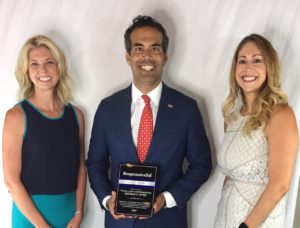 Commissioner George P. Bush with a plaque as a thank you for his time